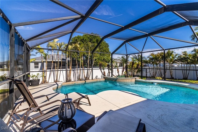 view of swimming pool with a patio and glass enclosure