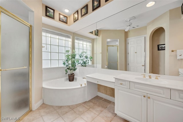 bathroom with a stall shower, ceiling fan, tile patterned floors, vanity, and a bath