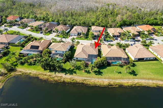 birds eye view of property with a water view