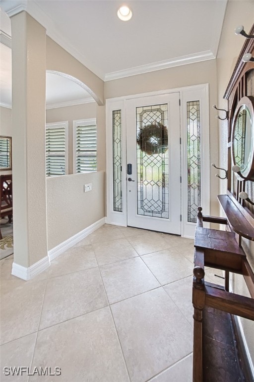 tiled entryway with crown molding