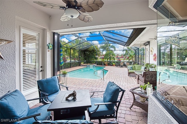 view of pool featuring a lanai, outdoor lounge area, and a patio