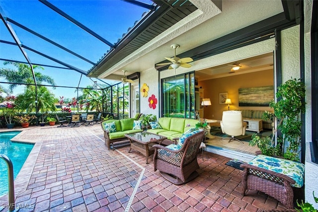 view of patio with ceiling fan, outdoor lounge area, and glass enclosure