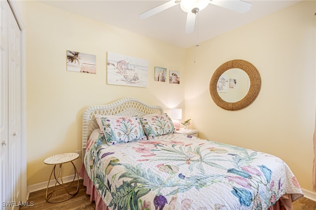 bedroom with hardwood / wood-style floors, a closet, and ceiling fan