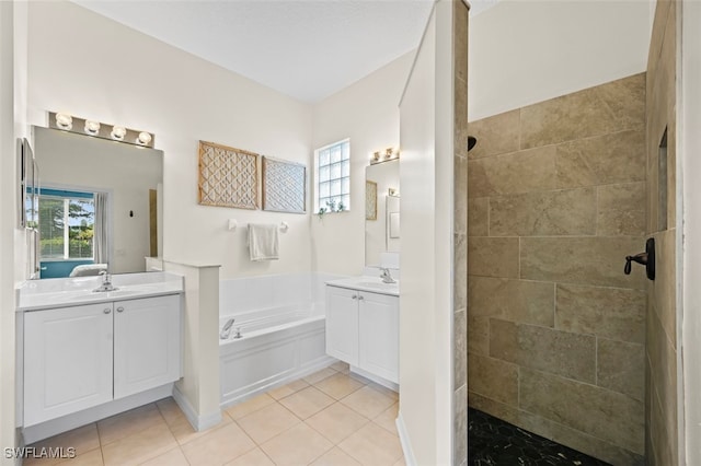 bathroom featuring tile patterned flooring, vanity, separate shower and tub, and a healthy amount of sunlight