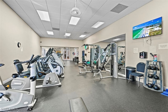 gym with a paneled ceiling