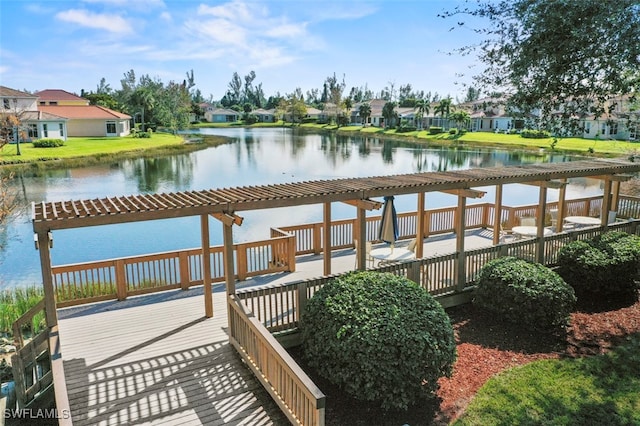 dock area with a water view and a pergola