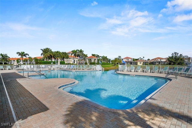 view of swimming pool featuring a patio area