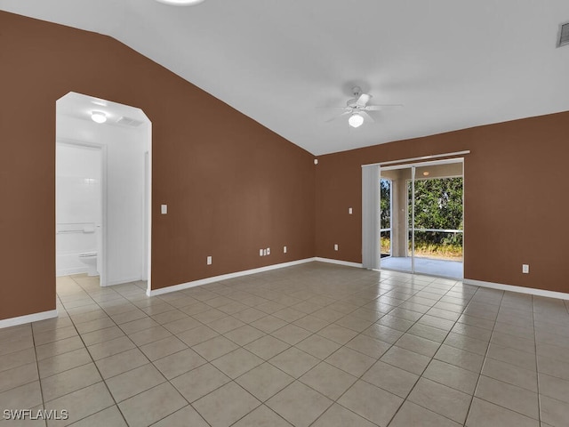 unfurnished room featuring vaulted ceiling, ceiling fan, and light tile patterned flooring