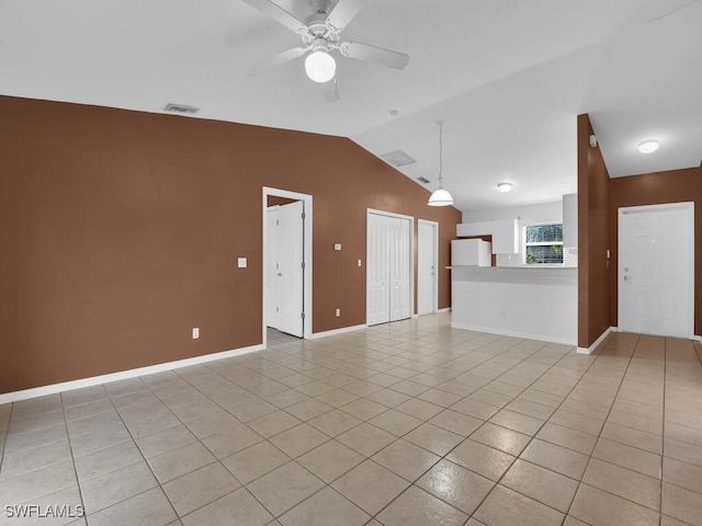 unfurnished living room featuring light tile patterned flooring, ceiling fan, and lofted ceiling