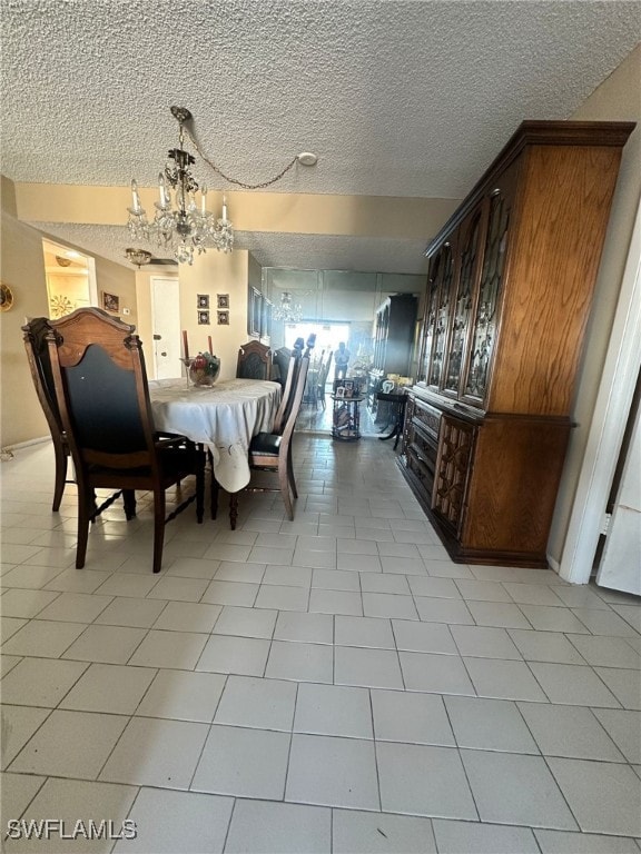 dining room with a notable chandelier and a textured ceiling