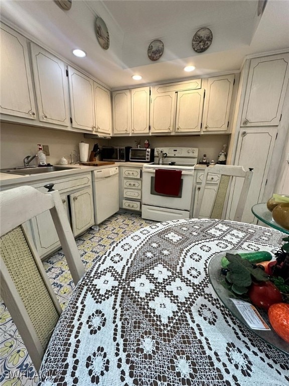 kitchen featuring sink and white appliances