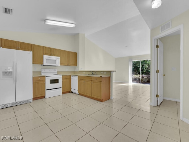 kitchen with lofted ceiling, sink, white appliances, light tile patterned floors, and kitchen peninsula