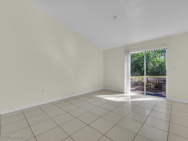 unfurnished room with light tile patterned flooring