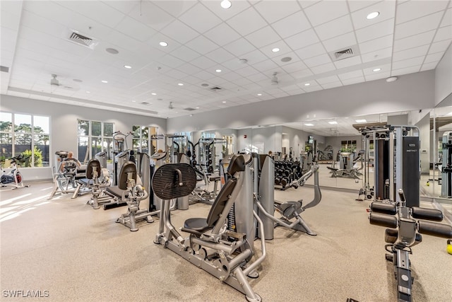 exercise room with a drop ceiling