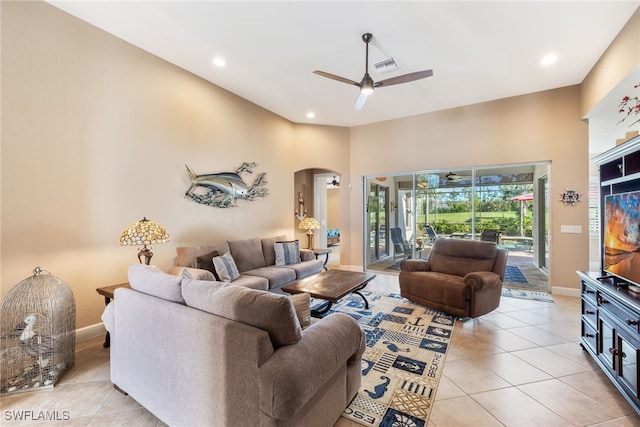 tiled living room with ceiling fan