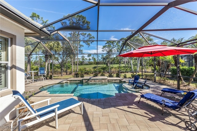 view of swimming pool featuring a lanai, a patio, and an in ground hot tub