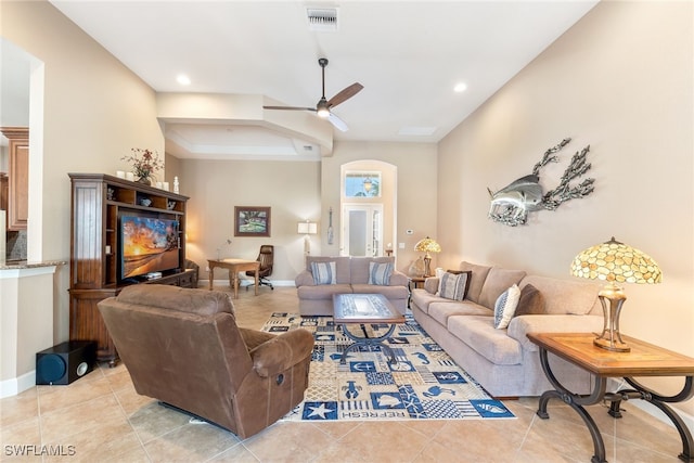 tiled living room with ceiling fan