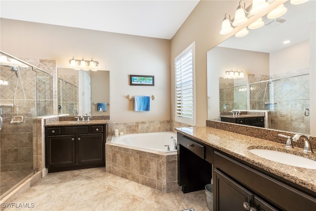 bathroom featuring vanity, tile patterned floors, shower with separate bathtub, and an inviting chandelier