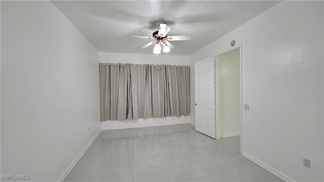 spare room with ceiling fan