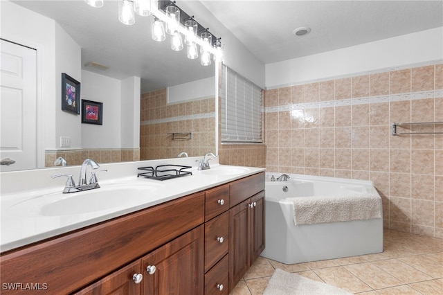 bathroom featuring vanity, a bathing tub, tile patterned flooring, and tile walls