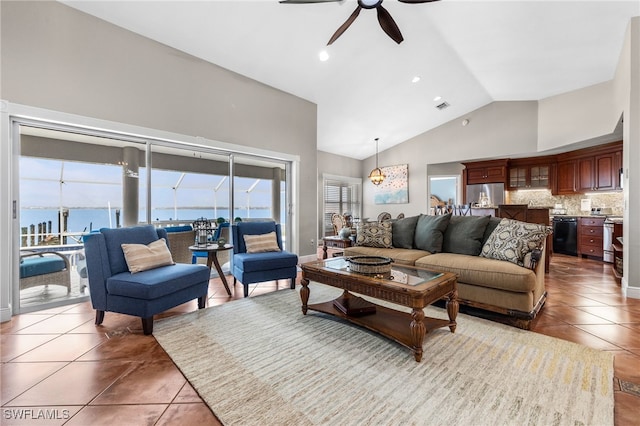 living room with high vaulted ceiling, tile patterned floors, ceiling fan, and a water view