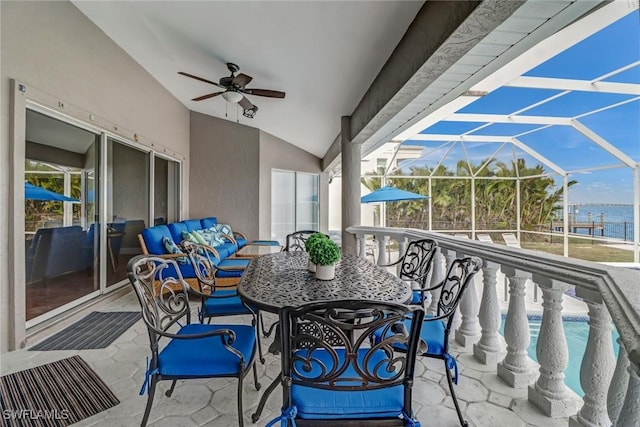 exterior space featuring a water view, ceiling fan, and an outdoor hangout area