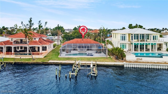 rear view of property with a water view, a patio area, and glass enclosure