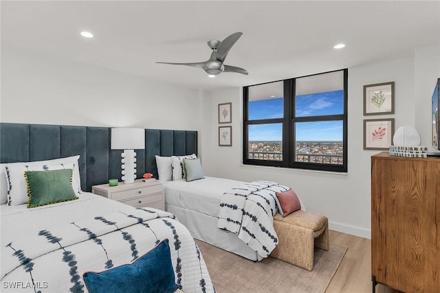 bedroom featuring ceiling fan and light wood-type flooring