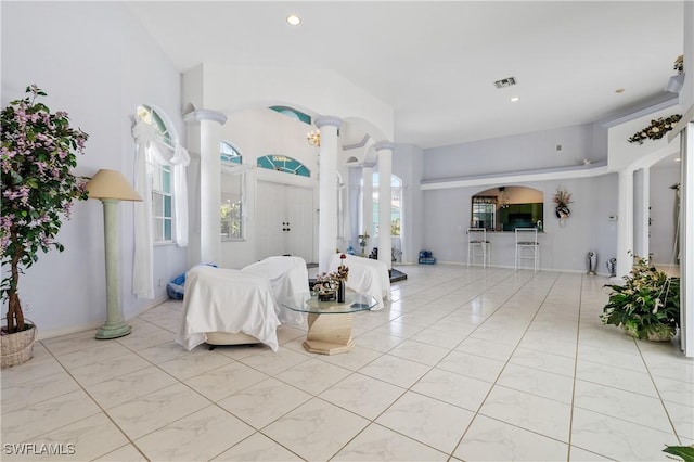 living room with decorative columns