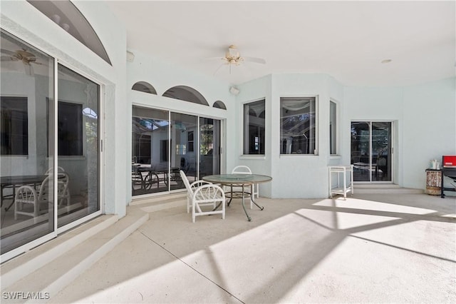 view of patio featuring ceiling fan