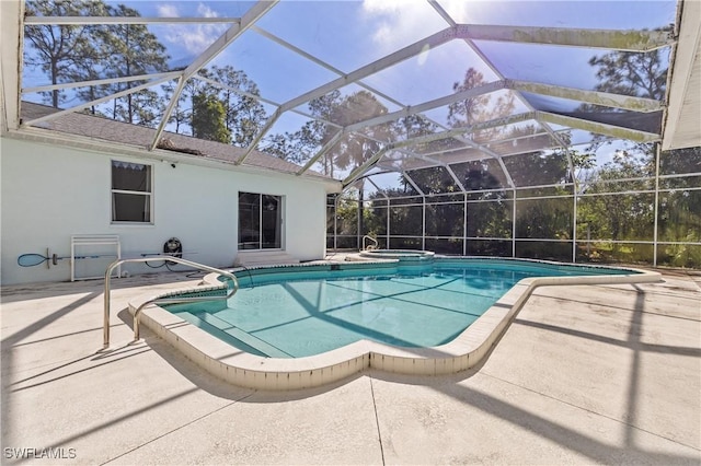 view of swimming pool featuring a patio and a lanai