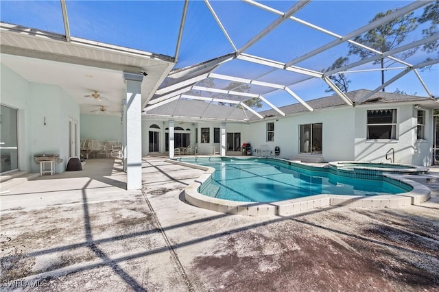 view of pool featuring a lanai, a patio area, ceiling fan, and an in ground hot tub