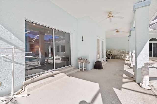 view of patio featuring ceiling fan