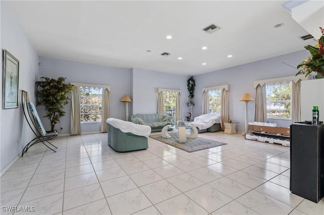 tiled living room featuring plenty of natural light