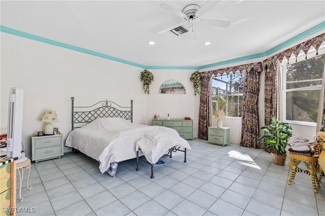 tiled bedroom featuring ceiling fan