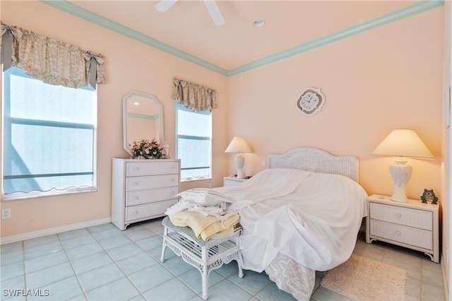 bedroom featuring ornamental molding, light tile patterned floors, and ceiling fan