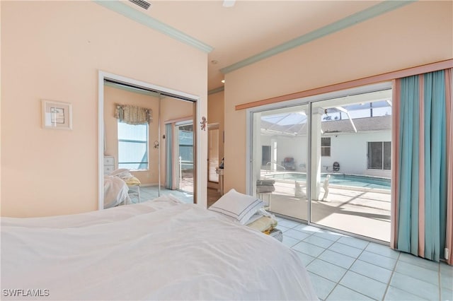 tiled bedroom featuring ornamental molding, access to outside, and a closet