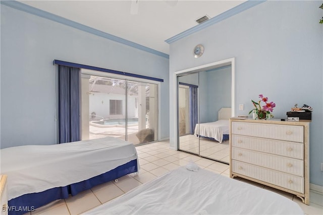 tiled bedroom with crown molding, ceiling fan, access to exterior, and a closet