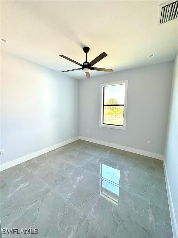 empty room featuring ceiling fan