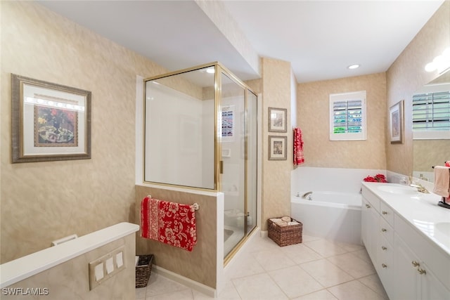 bathroom with tile patterned flooring, vanity, and separate shower and tub