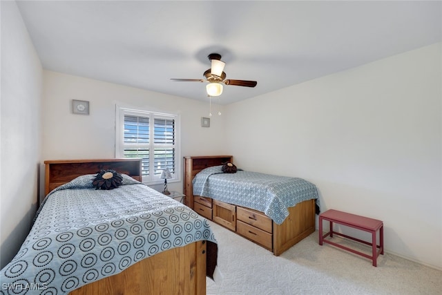 bedroom with ceiling fan and light colored carpet