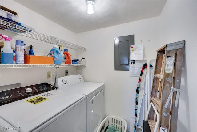 clothes washing area with laundry area, washing machine and dryer, and electric panel