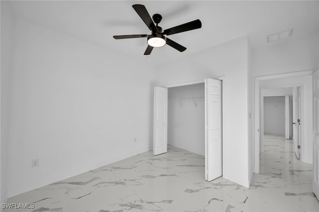 unfurnished bedroom featuring ceiling fan and a closet