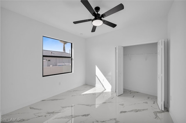 unfurnished bedroom featuring ceiling fan and a closet