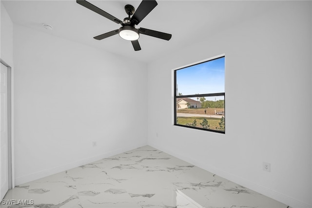 spare room with ceiling fan