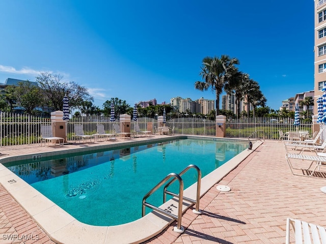 view of pool featuring a patio area