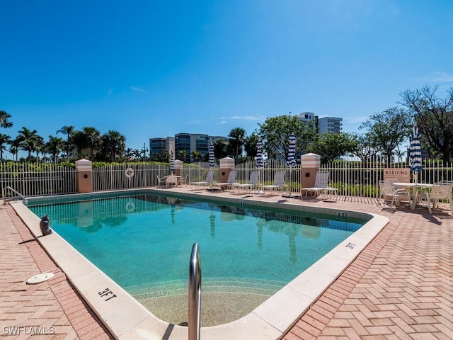 view of swimming pool featuring a patio