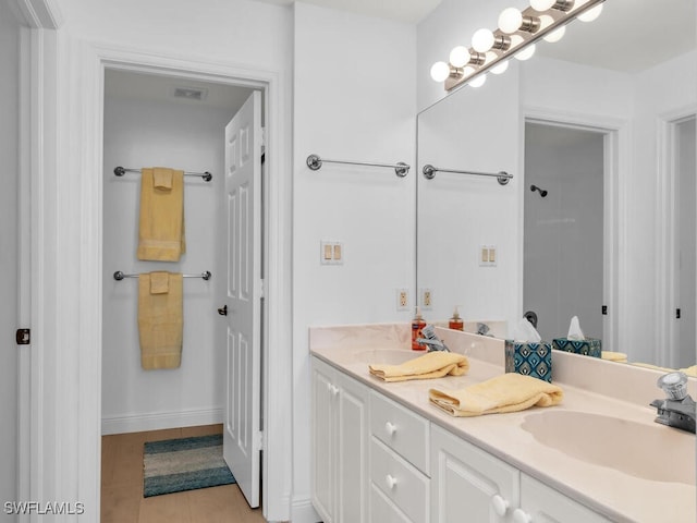 bathroom featuring vanity and tile patterned flooring