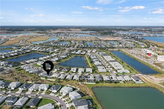 aerial view featuring a residential view and a water view