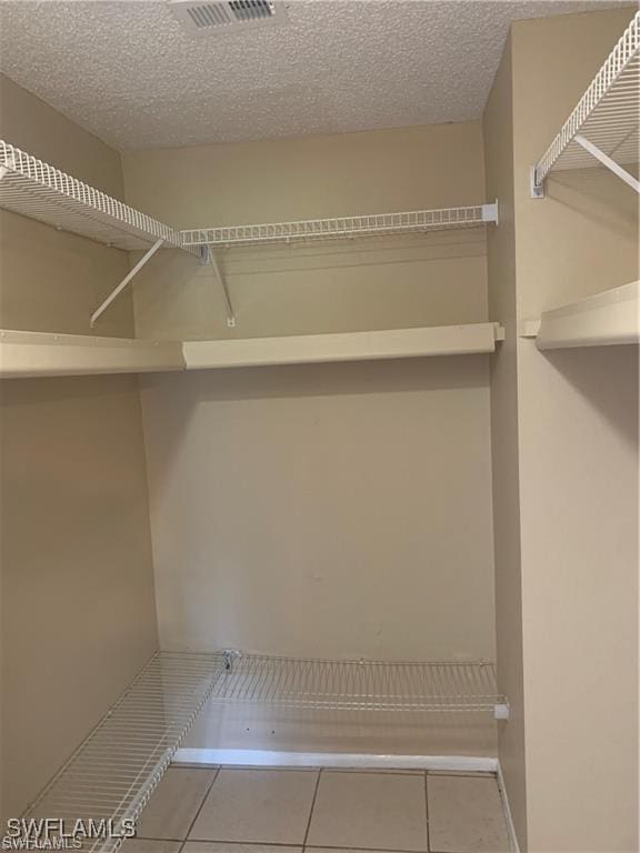 3926 Palm Tree Blvd, Cape Coral, FL 33904 - spacious closet featuring tile patterned floors
